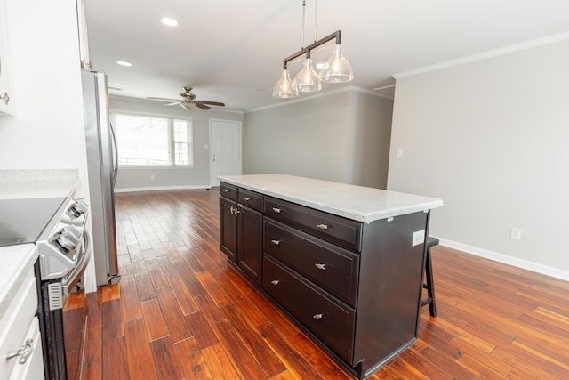 9412 Harrodsburg Rd, Wilmore, KY 40390 - kitchen featuring range with electric cooktop, freestanding refrigerator, ornamental molding, ceiling fan, and baseboards