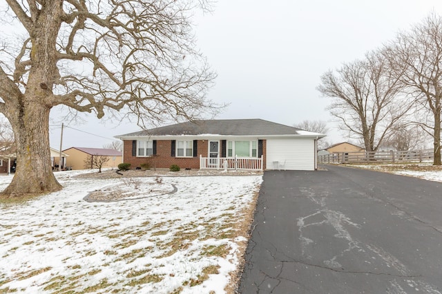9412 Harrodsburg Rd, Wilmore, KY 40390 - ranch-style house with covered porch, brick siding, and asphalt driveway