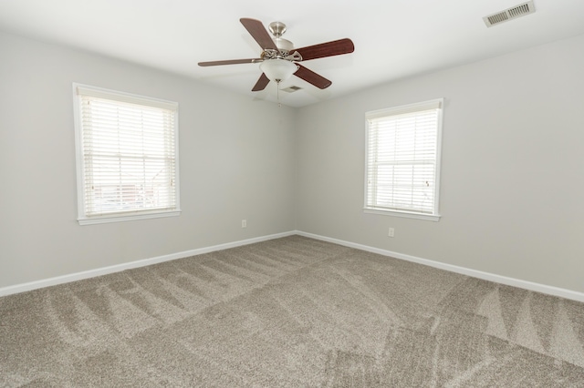 9412 Harrodsburg Rd, Wilmore, KY 40390 - empty room featuring carpet, plenty of natural light, baseboards, and ceiling fan