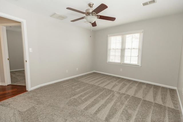 9412 Harrodsburg Rd, Wilmore, KY 40390 - empty room featuring carpet flooring, a ceiling fan, and baseboards