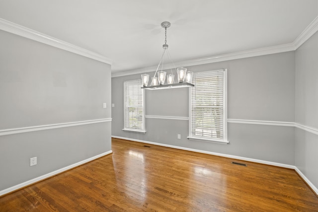 2152 Sallee Dr, Lexington, KY 40513 - unfurnished dining area featuring a chandelier, ornamental molding, baseboards, and wood finished floors