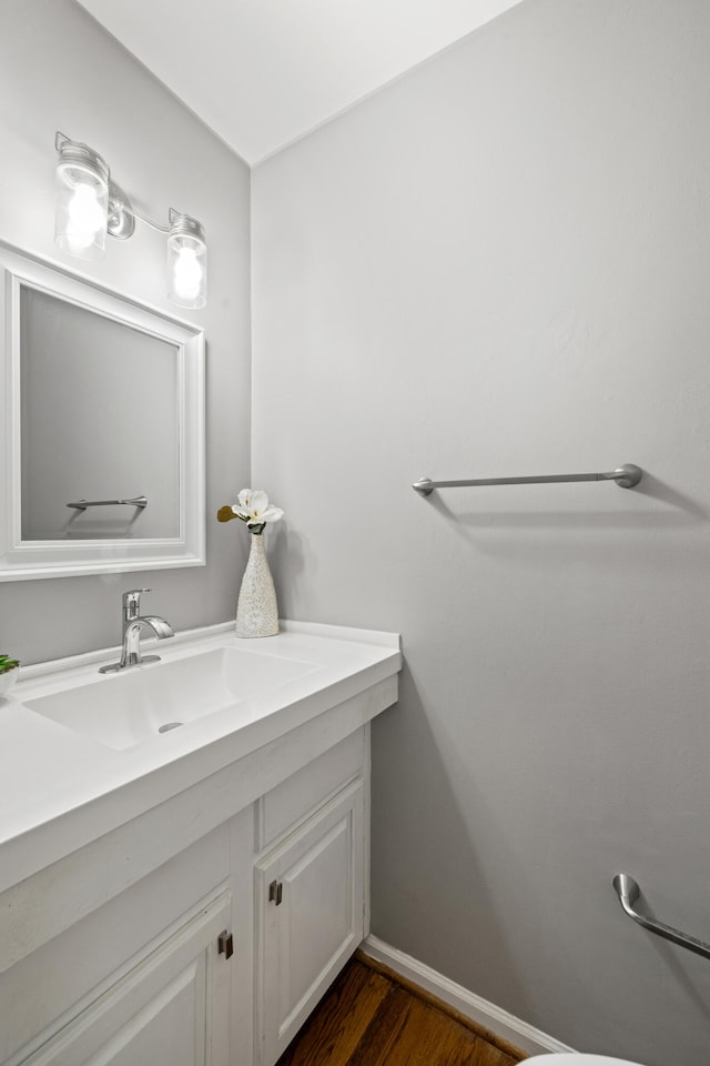 2152 Sallee Dr, Lexington, KY 40513 - bathroom with vanity, wood finished floors, and baseboards