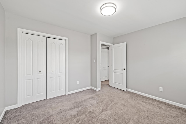 2152 Sallee Dr, Lexington, KY 40513 - unfurnished bedroom with carpet flooring, baseboards, and a closet