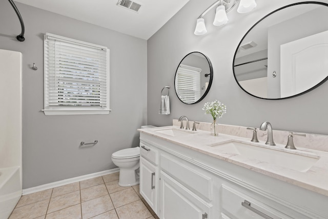 2152 Sallee Dr, Lexington, KY 40513 - full bathroom featuring double vanity, toilet, baseboards, tile patterned floors, and washtub / shower combination