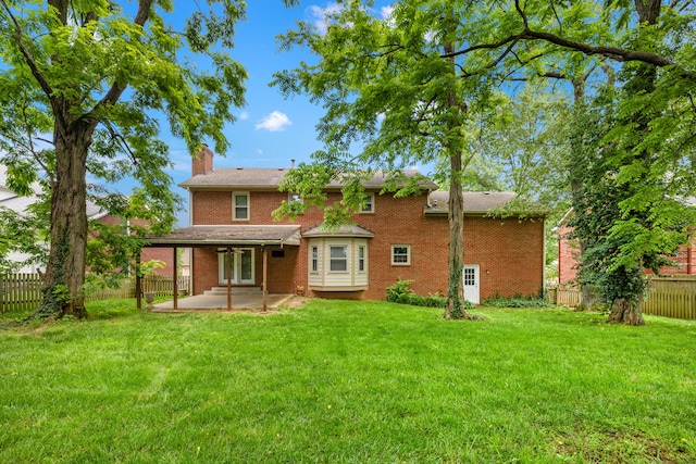 2152 Sallee Dr, Lexington, KY 40513 - rear view of property featuring a patio area, a chimney, brick siding, and a ceiling fan