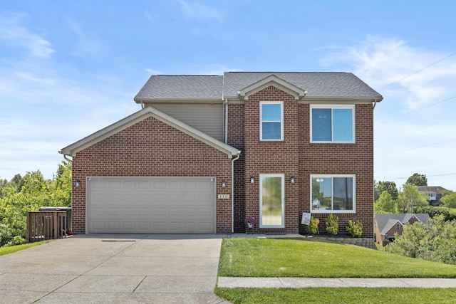112 Covington Way, Richmond, KY 40475 - view of front of house featuring an attached garage, driveway, a front yard, brick siding, and a shingled roof