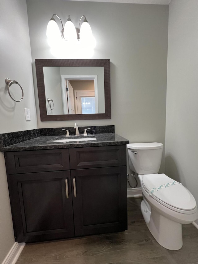 309 Gallahadion Ct, Winchester, KY 40391 - half bath with baseboards, toilet, vanity, and wood finished floors