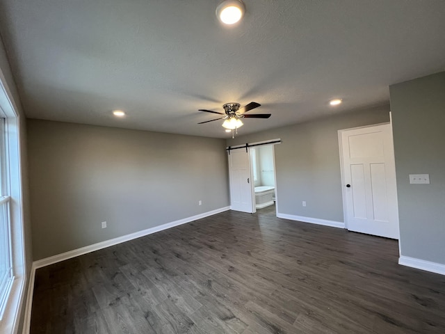 309 Gallahadion Ct, Winchester, KY 40391 - spare room with a barn door, a ceiling fan, baseboards, recessed lighting, and dark wood-style floors