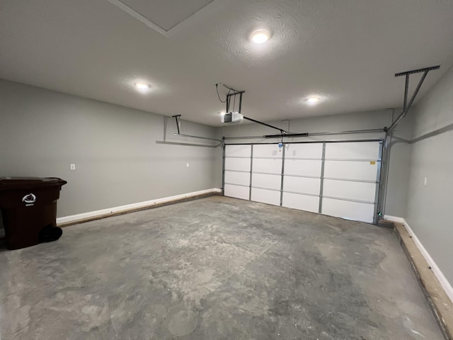 309 Gallahadion Ct, Winchester, KY 40391 - garage featuring a garage door opener and baseboards