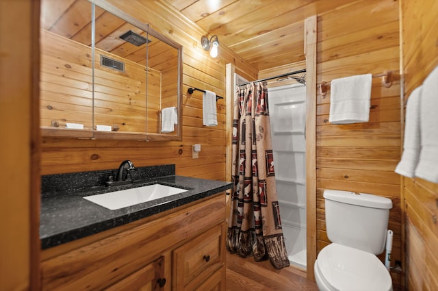 225 Grover Back Rd, Rogers, KY 41365 - full bath with wood walls, toilet, vanity, curtained shower, and wood finished floors