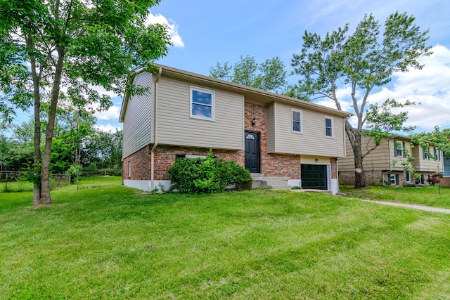 3617 Sundart Dr, Lexington, KY 40517 - bi-level home with brick siding, a garage, and driveway