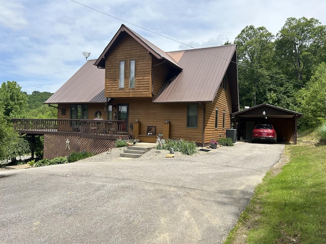 12430 E Ky-10, Quincy, KY 41166 - rustic home featuring a carport, asphalt driveway, metal roof, covered porch, and an outdoor structure