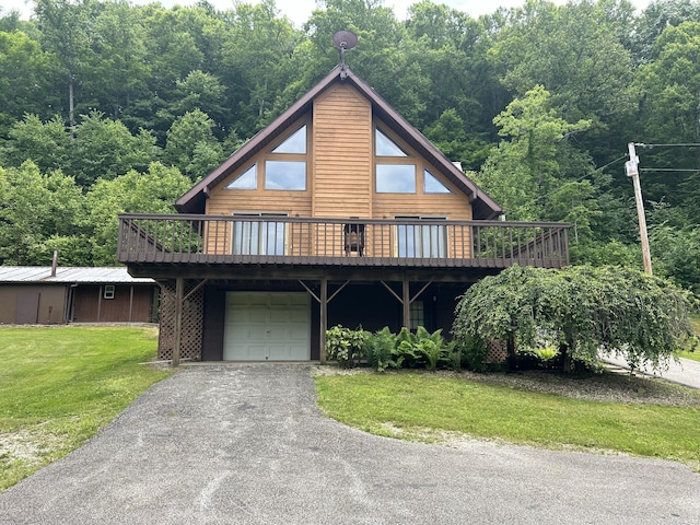 12430 E Ky-10, Quincy, KY 41166 - log cabin featuring a deck, a front lawn, an attached garage, asphalt driveway, and a forest view