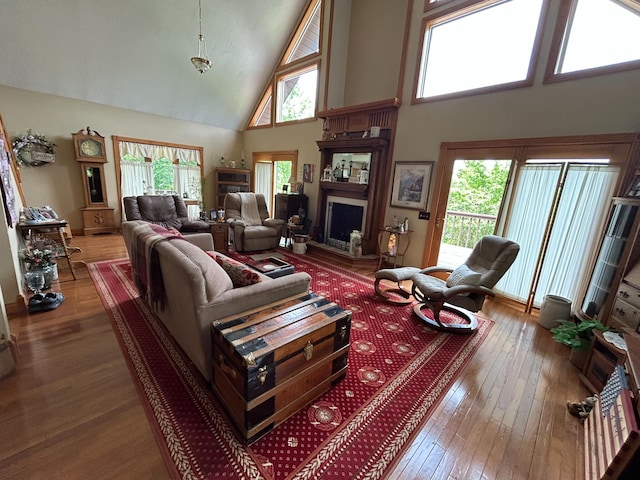 12430 E Ky-10, Quincy, KY 41166 - living room with a high ceiling, hardwood / wood-style floors, and a fireplace