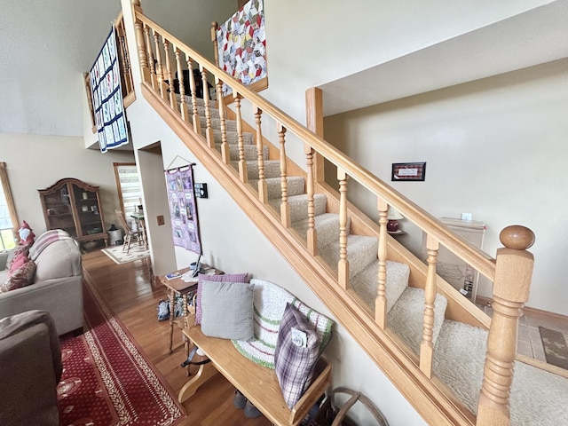 12430 E Ky-10, Quincy, KY 41166 - stairway featuring wood finished floors and a high ceiling