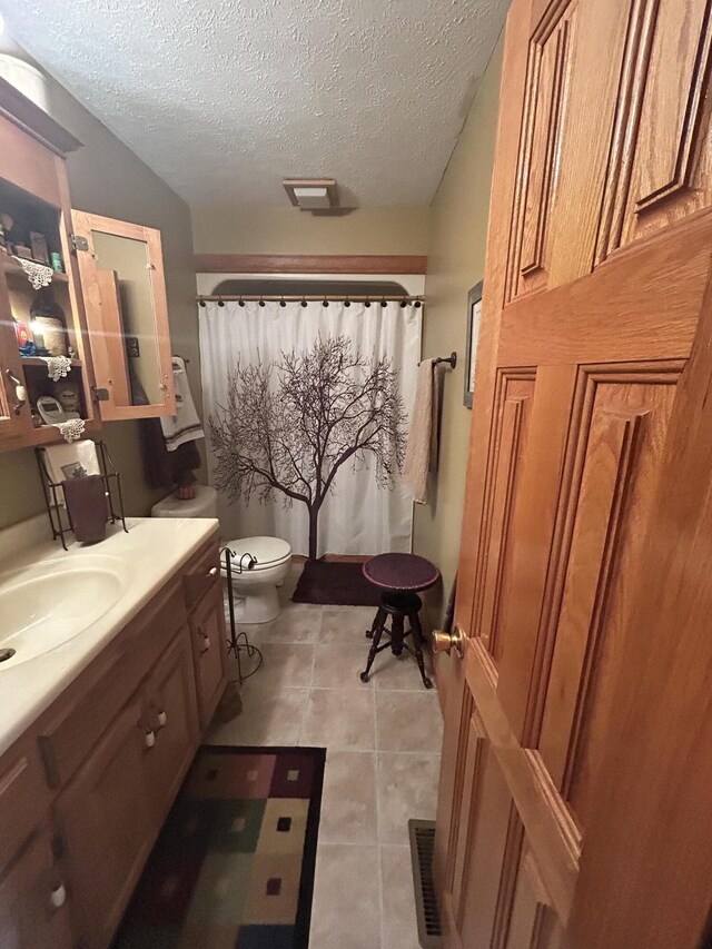 12430 E Ky-10, Quincy, KY 41166 - full bathroom featuring vanity, a textured ceiling, toilet, tile patterned flooring, and curtained shower
