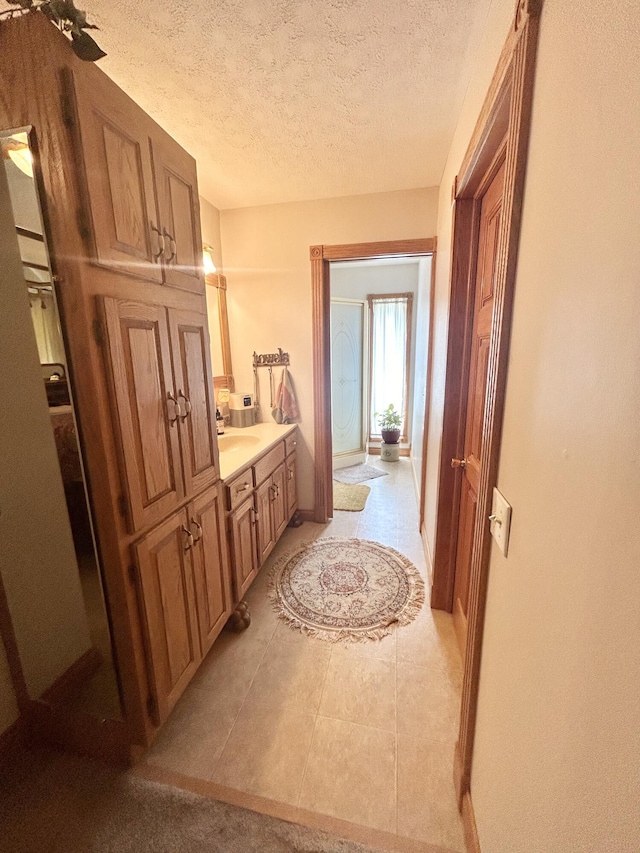 12430 E Ky-10, Quincy, KY 41166 - bathroom with a textured ceiling, vanity, and baseboards