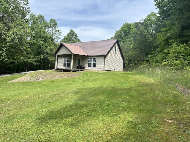 12430 E Ky-10, Quincy, KY 41166 - view of front of house featuring a front yard and metal roof
