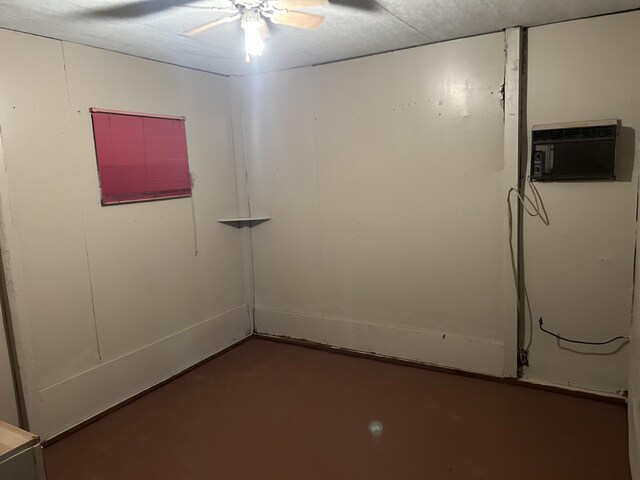 12430 E Ky-10, Quincy, KY 41166 - spare room featuring a ceiling fan, concrete flooring, and an AC wall unit