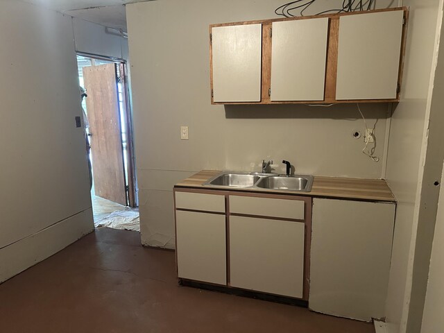 12430 E Ky-10, Quincy, KY 41166 - kitchen featuring a sink, white cabinets, concrete flooring, and light countertops