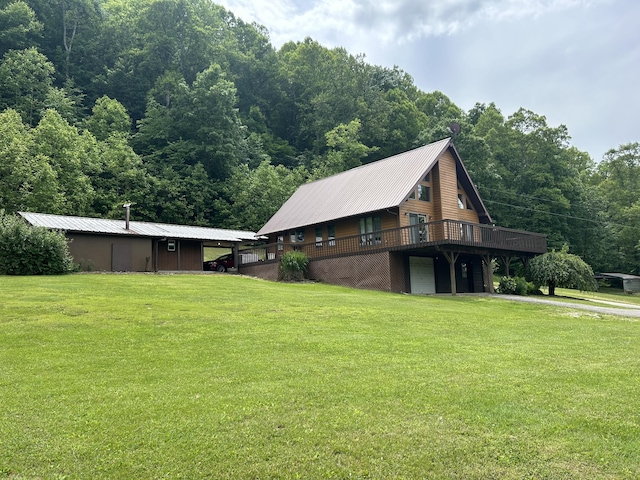 12430 E Ky-10, Quincy, KY 41166 - view of home's exterior with a yard, a wooden deck, a wooded view, and a garage