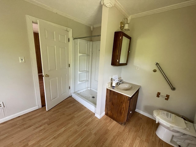 5069 Ky 11, Cannon, KY 40923 - full bathroom featuring a shower stall, vanity, wood finished floors, toilet, and ornamental molding