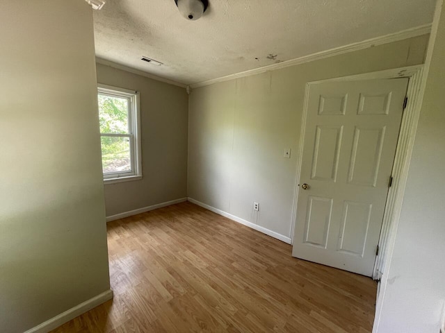 5069 Ky 11, Cannon, KY 40923 - empty room featuring ornamental molding, baseboards, wood finished floors, and a textured ceiling