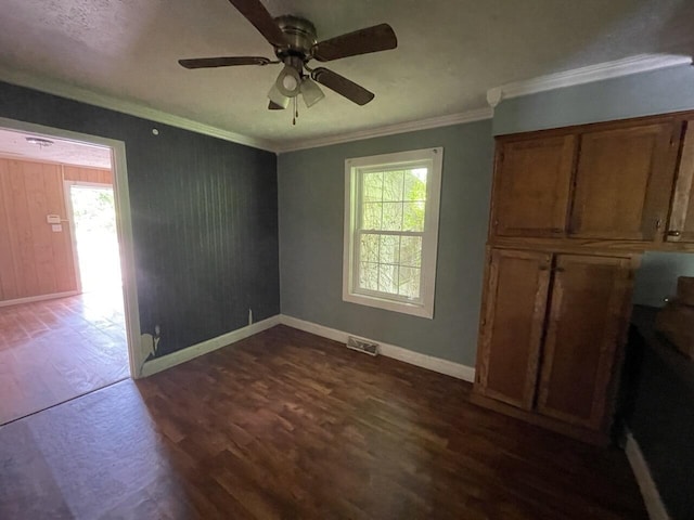 5069 Ky 11, Cannon, KY 40923 - spare room with dark wood finished floors, healthy amount of natural light, ceiling fan, baseboards, and ornamental molding