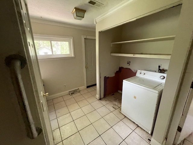 5069 Ky 11, Cannon, KY 40923 - laundry area featuring washer / clothes dryer, crown molding, and light tile patterned flooring