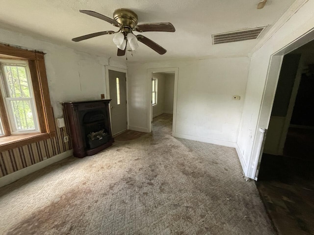5069 Ky 11, Cannon, KY 40923 - unfurnished living room with carpet floors, ceiling fan, a fireplace, and baseboards