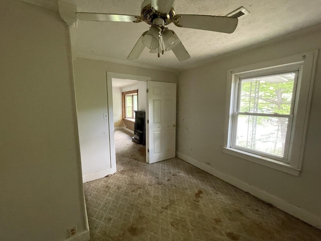 5069 Ky 11, Cannon, KY 40923 - unfurnished room with carpet flooring, baseboards, ceiling fan, and a textured ceiling