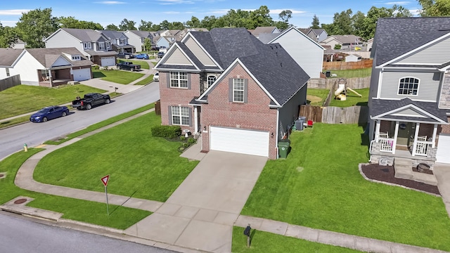 127 Schneider Blvd, Georgetown, KY 40324 - view of front of home featuring a residential view, brick siding, a garage, driveway, and roof with shingles