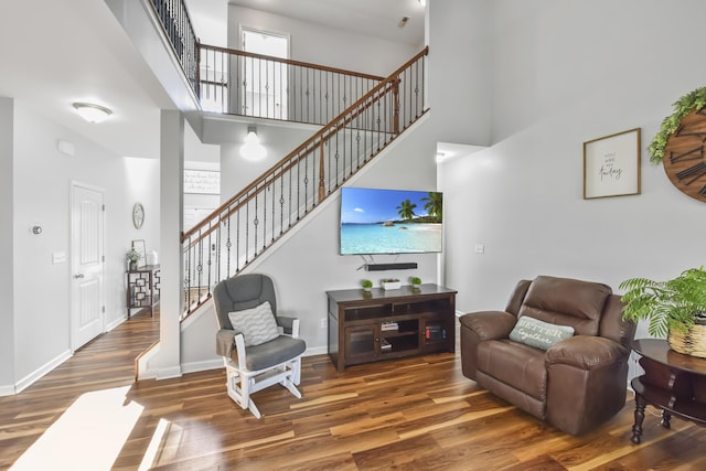 127 Schneider Blvd, Georgetown, KY 40324 - living area with a towering ceiling, wood finished floors, stairs, and baseboards