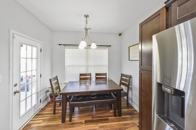127 Schneider Blvd, Georgetown, KY 40324 - dining room with a chandelier, light wood-type flooring, and baseboards