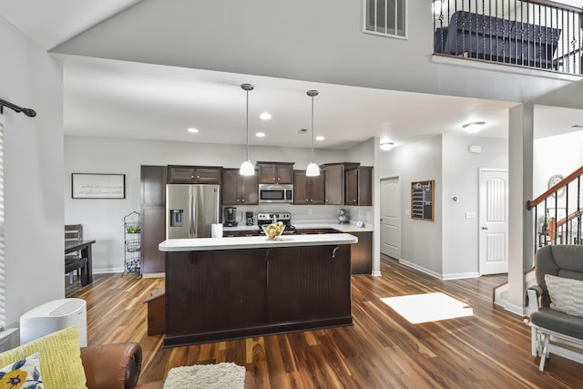 127 Schneider Blvd, Georgetown, KY 40324 - kitchen with stainless steel appliances, dark brown cabinets, light countertops, dark wood-style flooring, and recessed lighting