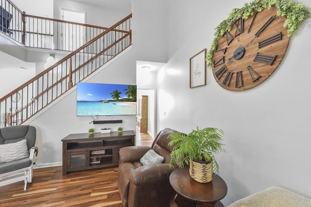 127 Schneider Blvd, Georgetown, KY 40324 - living area with a towering ceiling, stairs, wood finished floors, and baseboards