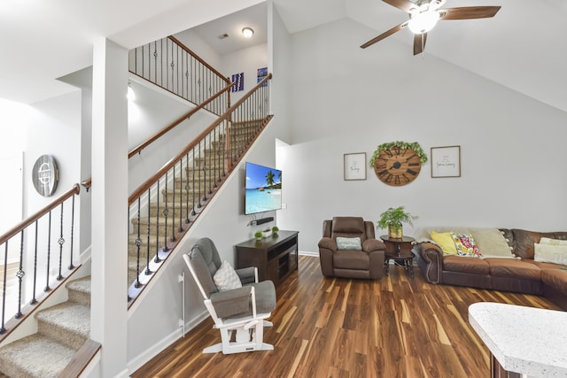 127 Schneider Blvd, Georgetown, KY 40324 - living room with high vaulted ceiling, wood finished floors, a ceiling fan, stairs, and baseboards