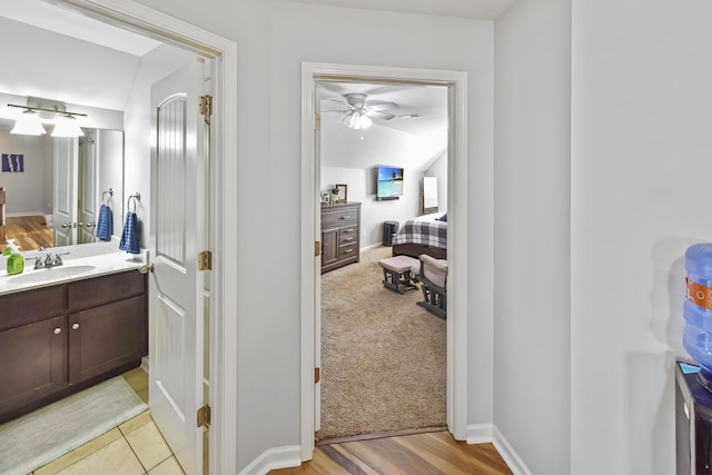 127 Schneider Blvd, Georgetown, KY 40324 - bathroom with vanity, ceiling fan, lofted ceiling, and baseboards