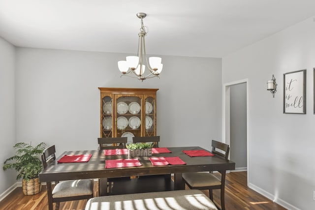 127 Schneider Blvd, Georgetown, KY 40324 - dining area with a chandelier, wood finished floors, and baseboards