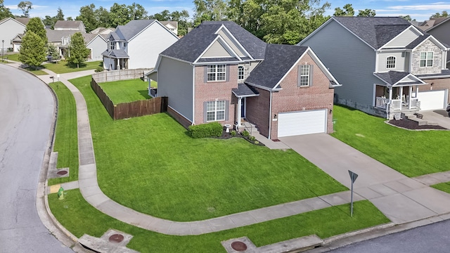 127 Schneider Blvd, Georgetown, KY 40324 - view of front of house with brick siding, an attached garage, driveway, a residential view, and a shingled roof