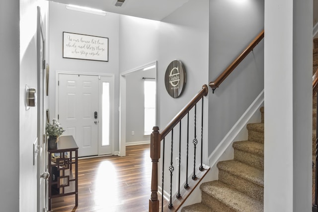 127 Schneider Blvd, Georgetown, KY 40324 - foyer with wood finished floors, stairway, a towering ceiling, and baseboards