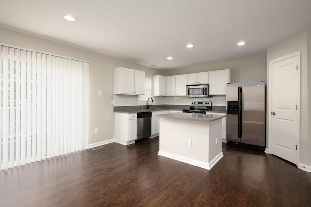 2429 Aristocracy Cir, Lexington, KY 40509 - kitchen featuring stainless steel appliances, dark wood finished floors, backsplash, white cabinetry, and recessed lighting
