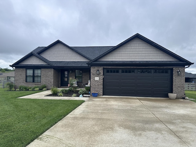 2042 Partridge Way, Richmond, KY 40475 - single story home featuring brick siding, concrete driveway, a front lawn, an attached garage, and a shingled roof