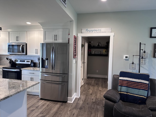 2042 Partridge Way, Richmond, KY 40475 - kitchen with stainless steel appliances, white cabinetry, recessed lighting, light stone countertops, and tasteful backsplash