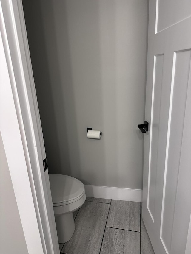 2042 Partridge Way, Richmond, KY 40475 - bathroom featuring toilet, baseboards, and wood finished floors