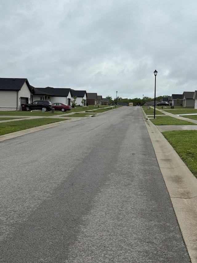 2042 Partridge Way, Richmond, KY 40475 - view of asphalt street featuring street lights, a residential view, sidewalks, and curbs