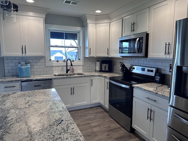 2042 Partridge Way, Richmond, KY 40475 - kitchen with stainless steel appliances, a sink, white cabinetry, recessed lighting, and dark wood-type flooring