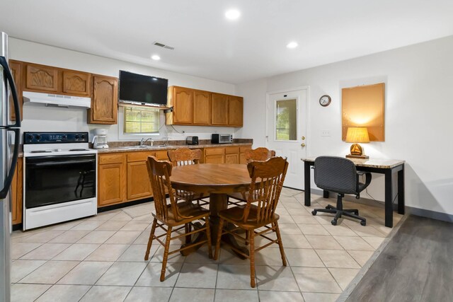 5830 Old Keno Rd, Burnside, KY 42519 - kitchen featuring white electric range, under cabinet range hood, a sink, brown cabinetry, and recessed lighting