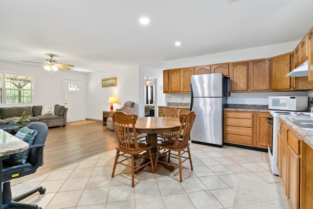 5830 Old Keno Rd, Burnside, KY 42519 - kitchen with white appliances, under cabinet range hood, open floor plan, recessed lighting, and brown cabinets