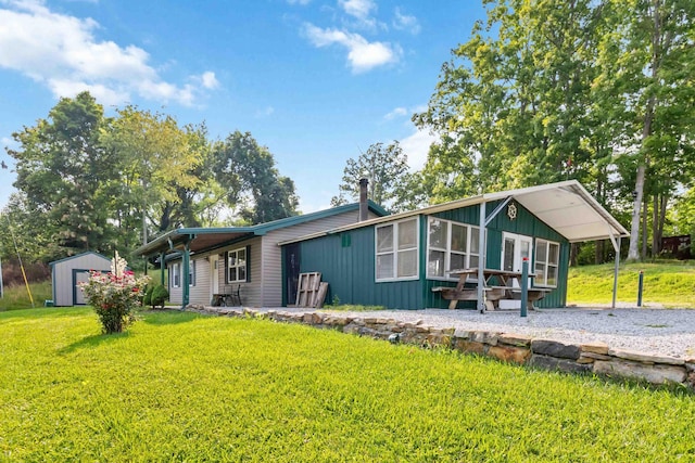 5830 Old Keno Rd, Burnside, KY 42519 - rear view of house featuring a yard and board and batten siding